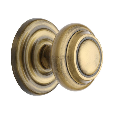 This is an image of a Heritage Brass - Centre Door Knob Round Design 3 1/2" Antique Brass Finish, v905-at that is available to order from T.H Wiggans Ironmongery in Kendal.