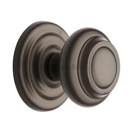 This is an image of a Heritage Brass - Centre Door Knob Round Design 3 1/2" Matt Bronze Finish, v905-mb that is available to order from T.H Wiggans Ironmongery in Kendal.