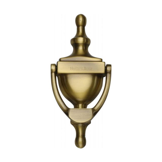 This is an image of a Heritage Brass - Urn Knocker 6" Antique Brass Finish, v910-152-at that is available to order from T.H Wiggans Ironmongery in Kendal.