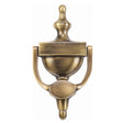 This is an image of a Heritage Brass - Urn Knocker 7 1/4" Antique Brass Finish, v910-195-at that is available to order from T.H Wiggans Ironmongery in Kendal.