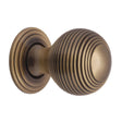 This is an image of a Heritage Brass - Cabinet Knob Reeded Design 32mm Antique Brass Finish, v973-32-at that is available to order from T.H Wiggans Ironmongery in Kendal.