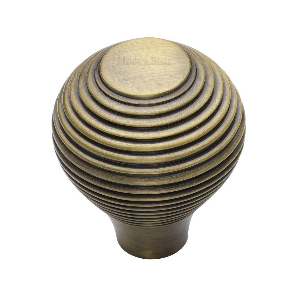 This is an image of a Heritage Brass - Cabinet Knob Reeded Design 38mm Antique Brass Finish, v974-38-at that is available to order from T.H Wiggans Ironmongery in Kendal.