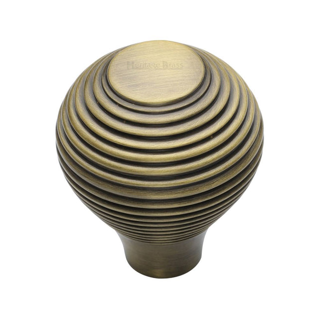 This is an image of a Heritage Brass - Cabinet Knob Reeded Design 38mm Antique Brass Finish, v974-38-at that is available to order from T.H Wiggans Ironmongery in Kendal.