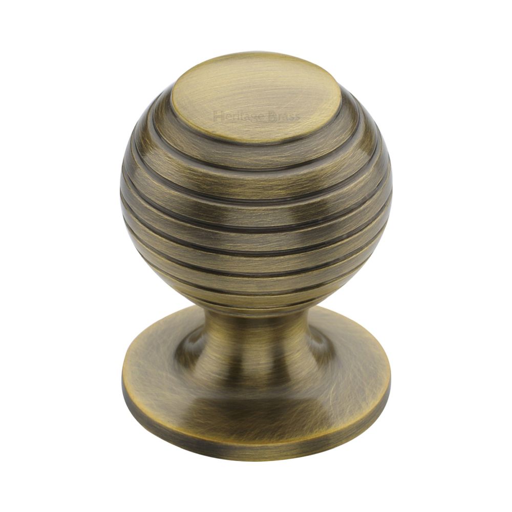 This is an image of a Heritage Brass - Cabinet Knob Beehive Design 32mm Antique Brass Finish, v976-32-at that is available to order from T.H Wiggans Ironmongery in Kendal.