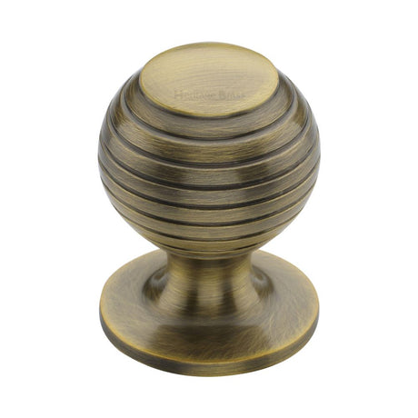 This is an image of a Heritage Brass - Cabinet Knob Beehive Design 32mm Antique Brass Finish, v976-32-at that is available to order from T.H Wiggans Ironmongery in Kendal.