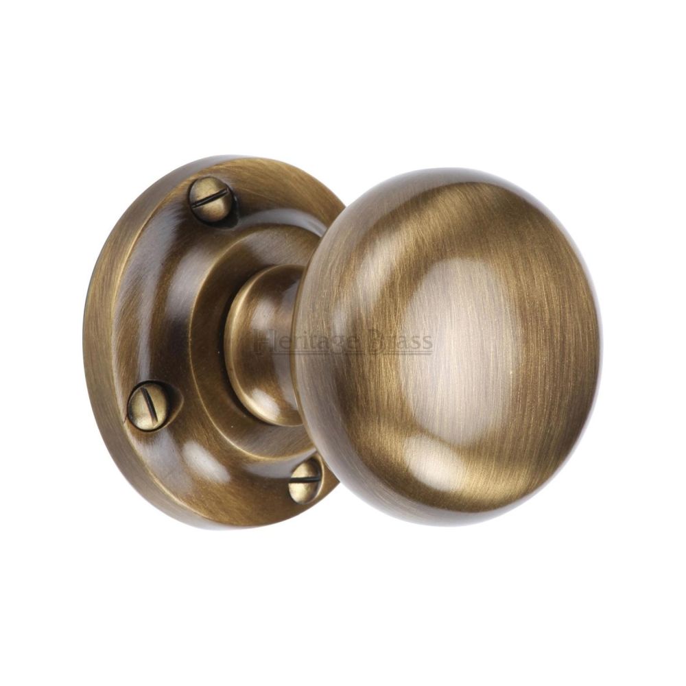 This is an image of a Heritage Brass - Mortice Knob on Rose Victoria Design Antique Brass Finish, v980-at that is available to order from T.H Wiggans Ironmongery in Kendal.