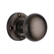 This is an image of a Heritage Brass - Mortice Knob on Rose Victoria Design Matt Bronze Finish, v980-mb that is available to order from T.H Wiggans Ironmongery in Kendal.