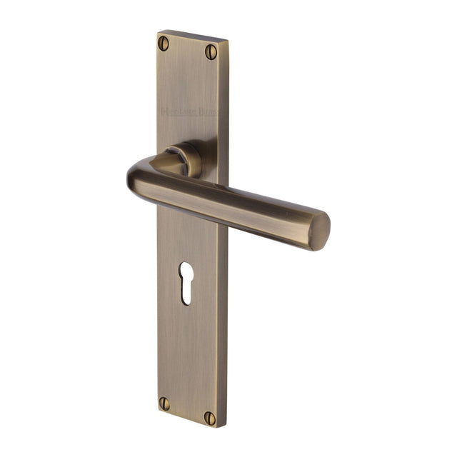 This is an image of a Heritage Brass - Octave Lever Lock Door Handle on 200mm Plate Antique Brass finish, vt5900-at that is available to order from T.H Wiggans Ironmongery in Kendal.