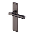This is an image of a Heritage Brass - Bauhaus Lever Latch Door Handle on 200mm Plate Matt Bronze finish, vt6310-mb that is available to order from T.H Wiggans Ironmongery in Kendal.