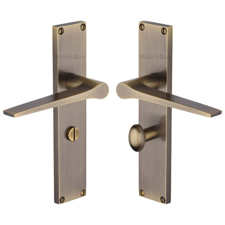 This is an image of a Heritage Brass - Gio Bathroom Set Door Handle on 200mm Plate Antique Brass finish, vt8130-at that is available to order from T.H Wiggans Ironmongery in Kendal.