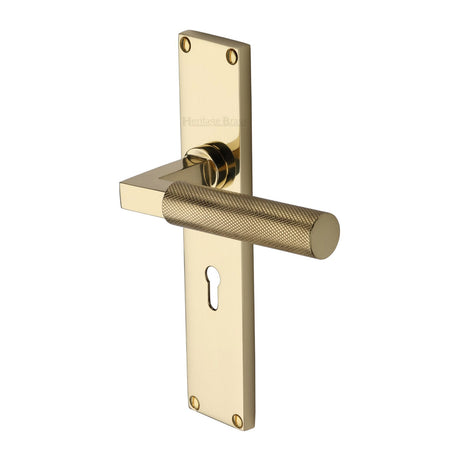 This is an image of a Heritage Brass - Bauhaus Knurled Lever Lock Door Handle on 200mm Plate Polished Brass finish, vt9300-pb that is available to order from T.H Wiggans Ironmongery in Kendal.