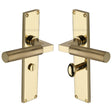 This is an image of a Heritage Brass - Bauhaus Knurled Bathroom Set Door Handle on 200mm Plate Polished Brass finish, vt9330-pb that is available to order from T.H Wiggans Ironmongery in Kendal.