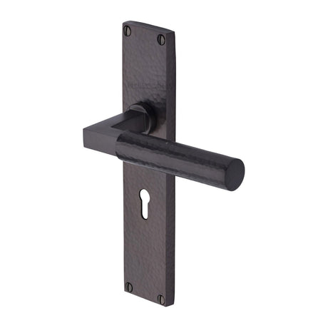 This is an image of a Heritage Brass - Bauhaus Hammered Lever Lock Door Handle on 200mm Plate Matt Bronze finish, vth4300-mb that is available to order from T.H Wiggans Ironmongery in Kendal.