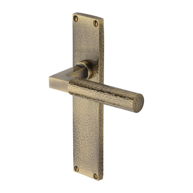 This is an image of a Heritage Brass - Bauhaus Hammered Lever Latch Door Handle on 200mm Plate Antique Brass finish, vth4310-at that is available to order from T.H Wiggans Ironmongery in Kendal.