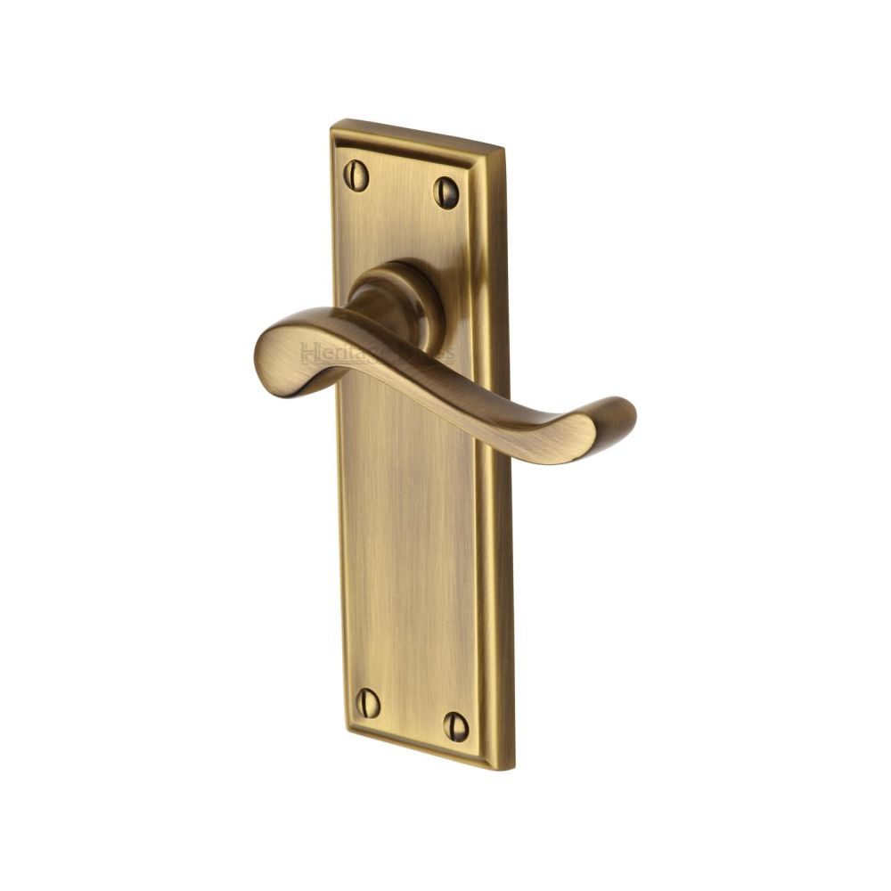 This is an image of a Heritage Brass - Door Handle Lever Latch Edwardian Design Antique Brass Finish, w3213-at that is available to order from T.H Wiggans Ironmongery in Kendal.