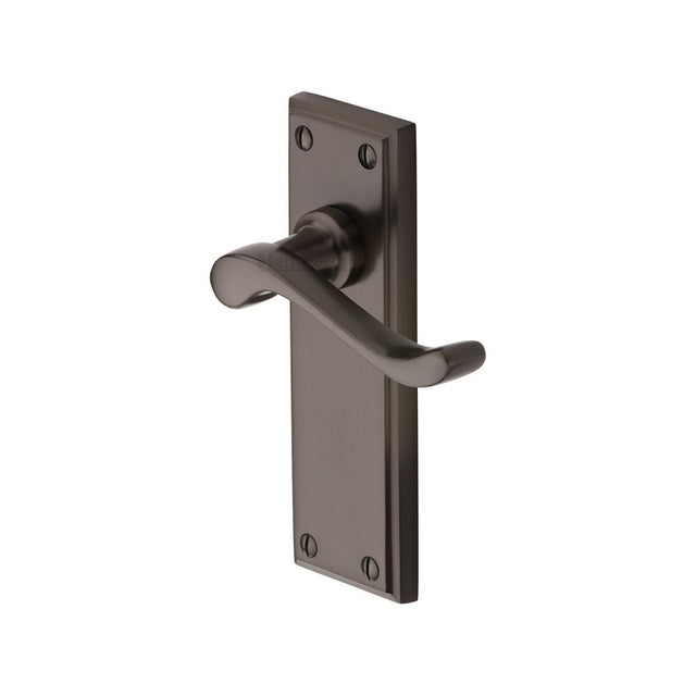 This is an image of a Heritage Brass - Door Handle Lever Latch Edwardian Design Matt Bronze Finish, w3213-mb that is available to order from T.H Wiggans Ironmongery in Kendal.