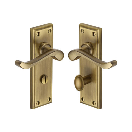 This is an image of a Heritage Brass - Door Handle for Bathroom Edwardian Design Antique Brass Finish, w3220-at that is available to order from T.H Wiggans Ironmongery in Kendal.