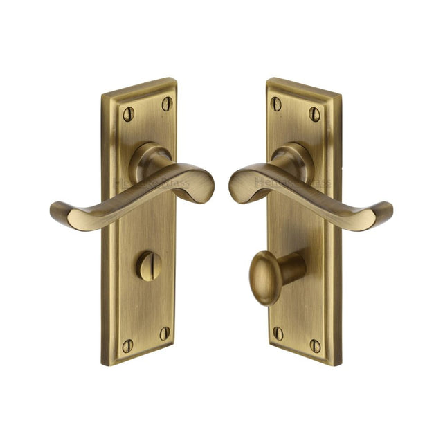 This is an image of a Heritage Brass - Door Handle for Bathroom Edwardian Design Antique Brass Finish, w3220-at that is available to order from T.H Wiggans Ironmongery in Kendal.