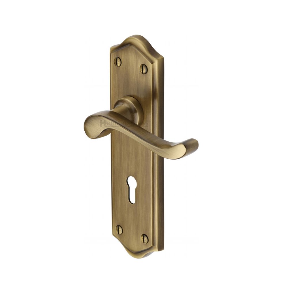 This is an image of a Heritage Brass - Door Handle Lever Lock Buckingham Design Antique Brass Finish, w4200-at that is available to order from T.H Wiggans Ironmongery in Kendal.