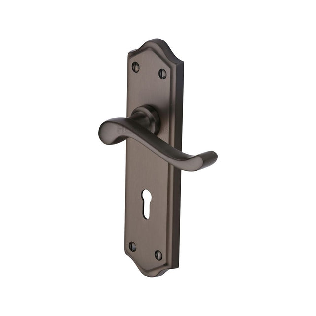 This is an image of a Heritage Brass - Door Handle Lever Lock Buckingham Design Matt Bronze Finish, w4200-mb that is available to order from T.H Wiggans Ironmongery in Kendal.