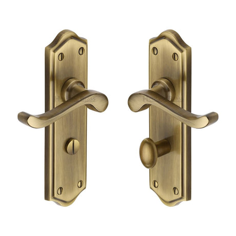 This is an image of a Heritage Brass - Door Handle for Bathroom Buckingham Design Antique Brass Finish, w4220-at that is available to order from T.H Wiggans Ironmongery in Kendal.