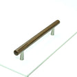 This is an image of a M.Marcus - Wooden Cabinet Pull Handle T-Bar Tilaa Design 160mm Walnut Finish, w7763-160-wal that is available to order from T.H Wiggans Ironmongery in Kendal.