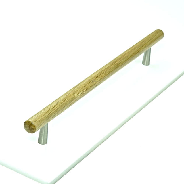 This is an image of a M.Marcus - Wooden Cabinet Pull Handle T-Bar Tilaa Design 224mm Oak Finish, w7763-224-oak that is available to order from T.H Wiggans Ironmongery in Kendal.
