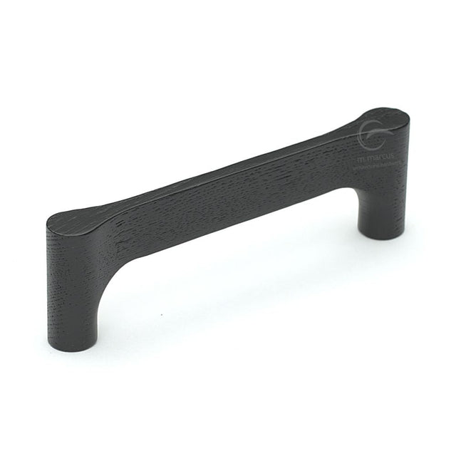 This is an image of a M.Marcus - Wooden Cabinet Pull Handle Gio Design 128mm Black Ash Finish, w7827-128-ash that is available to order from T.H Wiggans Ironmongery in Kendal.