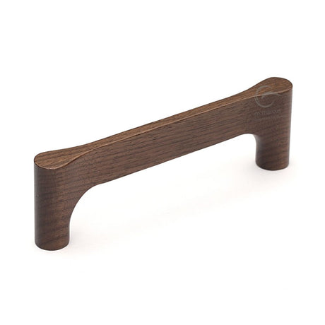 This is an image of a M.Marcus - Wooden Cabinet Pull Handle Gio Design 128mm Walnut Finish, w7827-128-wal that is available to order from T.H Wiggans Ironmongery in Kendal.
