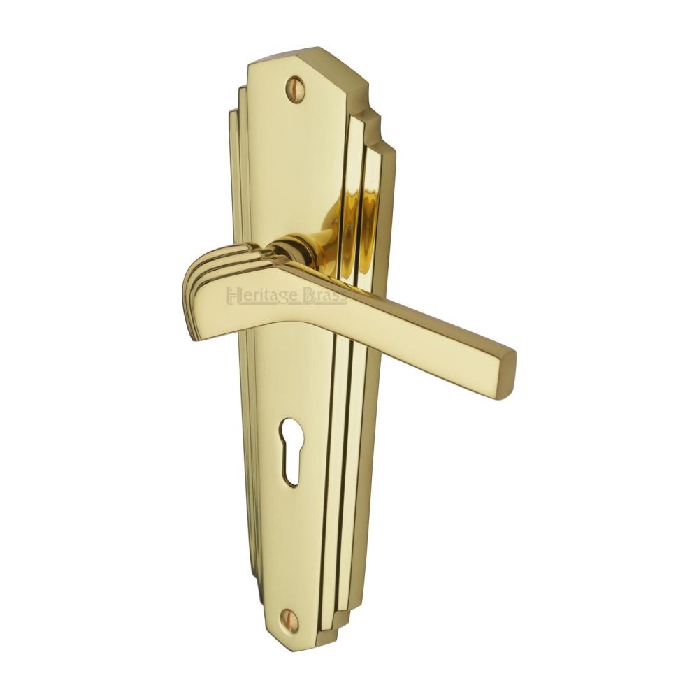 This is an image of a Heritage Brass - Door Handle Lever Lock Waldorf Design Polished Brass Finish, wal6500-pb that is available to order from T.H Wiggans Ironmongery in Kendal.
