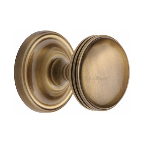This is an image of a Heritage Brass - Mortice Knob on Rose Whitehall Design Antique Brass Finish, whi6429-at that is available to order from T.H Wiggans Ironmongery in Kendal.