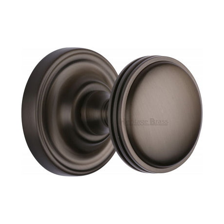This is an image of a Heritage Brass - Mortice Knob on Rose Whitehall Design Matt Bronze Finish, whi6429-mb that is available to order from T.H Wiggans Ironmongery in Kendal.
