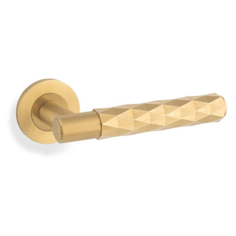 This is an image showing Alexander & Wilks Spitfire Diamond Cut Lever on Round Rose - Satin Brass PVD - aw226-SBPVD available to order from T.H. Wiggans Ironmongery in Kendal, quick delivery and discounted prices.