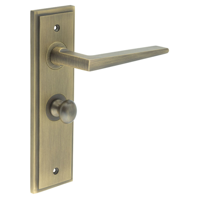 This is an image showing the Frelan - Mayfair Door Handle Bathroom Backplate Antique Brass & Turn & Release available to order from T.H. Wiggans Ironmongery in Kendal