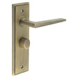 This is an image showing the Frelan - Mayfair Door Handle Bathroom Backplate Antique Brass & Turn & Release available to order from T.H. Wiggans Ironmongery in Kendal