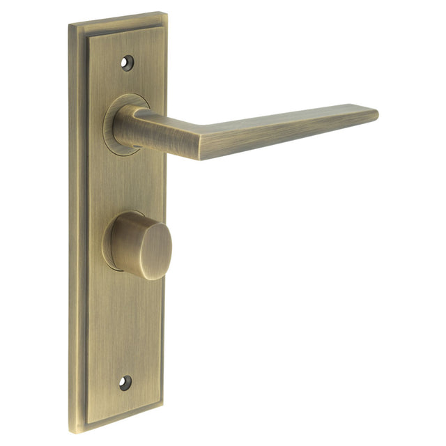 This is an image showing the Frelan - Mayfair Door Handle Bathroom Backplate Antique Brass & Turn & Release available to order from T.H. Wiggans Ironmongery in Kendal