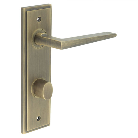 This is an image showing the Frelan - Mayfair Door Handle Din Bathroom Backplate Antique Brass & Turn & Release available to order from T.H. Wiggans Ironmongery in Kendal