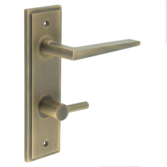 This is an image showing the Frelan - Mayfair Door Handle Din Bathroom Backplate Antique Brass & Turn & Release available to order from T.H. Wiggans Ironmongery in Kendal