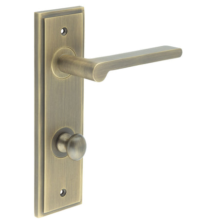 This is an image showing the Frelan - Fitzrovia Door Handle Din Bathroom Backplate Antique Brass & Turn & Release available to order from T.H. Wiggans Ironmongery in Kendal