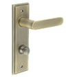 This is an image showing the Frelan - Kensington Door Handle Din Bathroom Backplate Antique Brass & Turn & Release available to order from T.H. Wiggans Ironmongery in Kendal