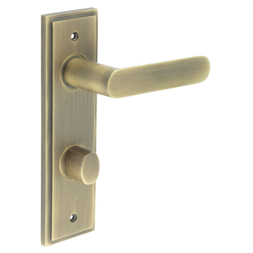 This is an image showing the Frelan - Kensington Door Handle Din Bathroom Backplate Antique Brass & Turn & Release available to order from T.H. Wiggans Ironmongery in Kendal