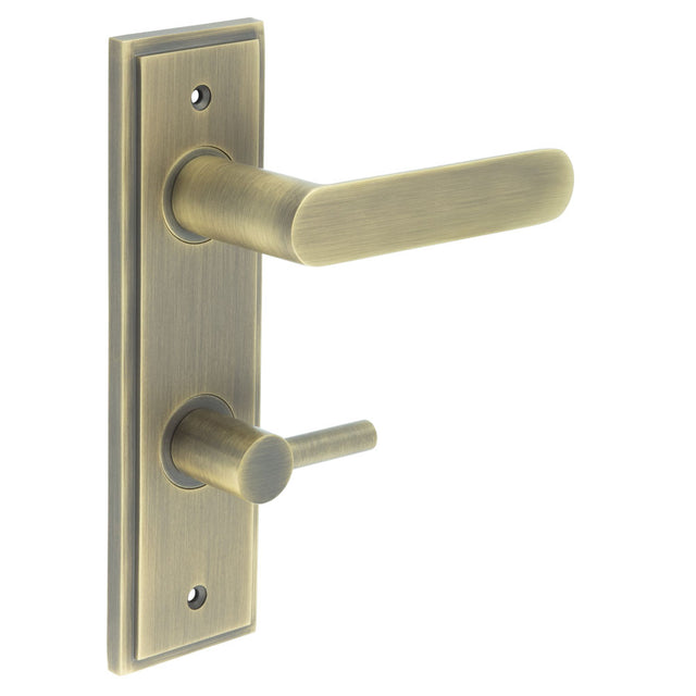 This is an image showing the Frelan - Kensington Door Handle Din Bathroom Backplate Antique Brass & Turn & Release available to order from T.H. Wiggans Ironmongery in Kendal