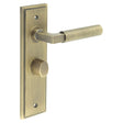 This is an image showing the Frelan - Westminster Door Handle Bathroom Backplate Antique Brass & Turn & Release available to order from T.H. Wiggans Ironmongery in Kendal