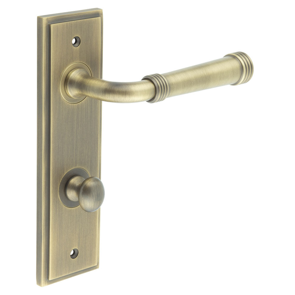 This is an image showing the Frelan - Highgate Door Handle Din Bathroom Backplate Antique Brass & Turn & Release available to order from T.H. Wiggans Ironmongery in Kendal