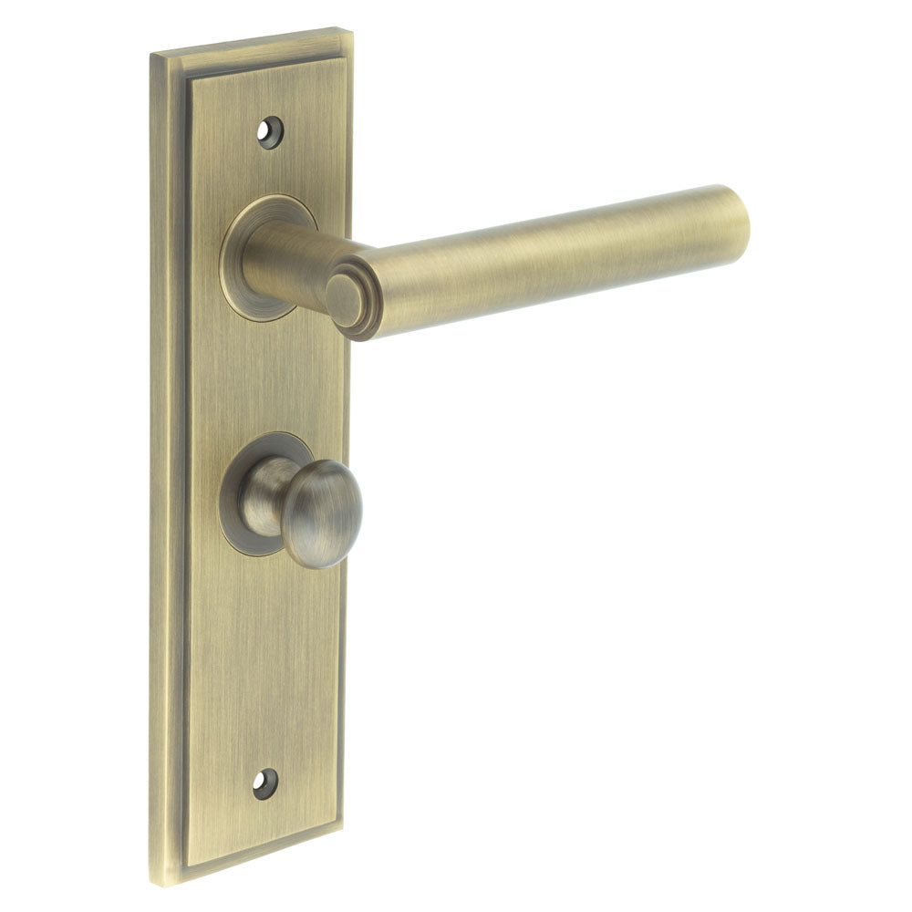 This is an image showing the Frelan - Richmond Door Handle Bathroom Backplate Antique Brass & Turn & Release available to order from T.H. Wiggans Ironmongery in Kendal