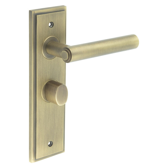 This is an image showing the Frelan - Richmond Door Handle Bathroom Backplate Antique Brass & Turn & Release available to order from T.H. Wiggans Ironmongery in Kendal