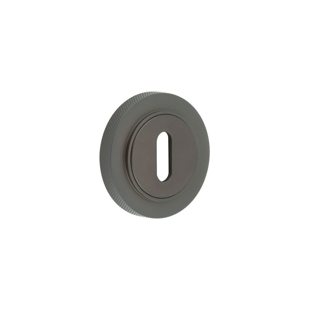 This is an image showing the Frelan - Burlington Standard Keyway Escutcheons Knurled Rose Dark Bronze available to order from T.H. Wiggans Ironmongery in Kendal
