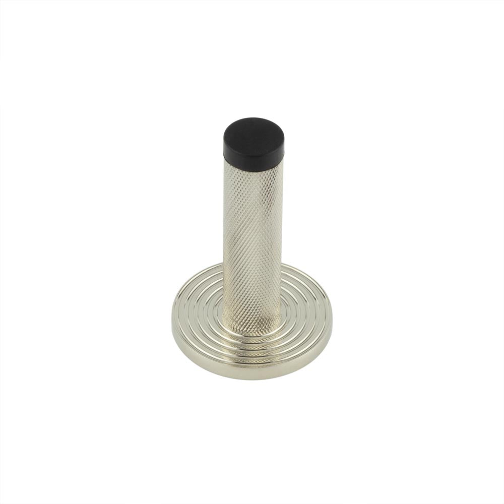 This is an image showing the Frelan - Burlington Knurled Wall Mounted Door Stop Reeded Rose Polished Nickel available to order from T.H. Wiggans Ironmongery in Kendal