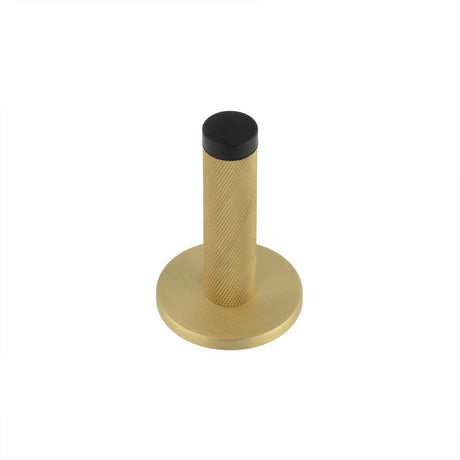 This is an image showing the Frelan - Burlington Knurled Wall Mounted Door Stop Plain Rose Satin Brass available to order from T.H. Wiggans Ironmongery in Kendal