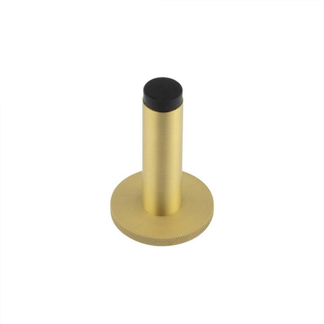 This is an image showing the Frelan - Burlington Plain Wall Mounted Door Stops Knurled Rose Satin Brass available to order from T.H. Wiggans Ironmongery in Kendal